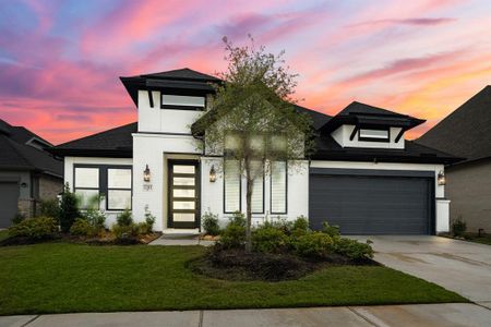 Welcome home to 7311 Compass Drive! This modern 1 story home welcomes you with an elegant exterior featuring white painted brick and stucco, contrasting dark trim, upgraded bronze windows, and a 2 car garage!