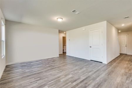 Unfurnished room with light wood-type flooring