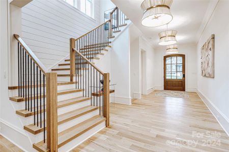 Soaring ceilings and beautiful white oak flooring throughout the home