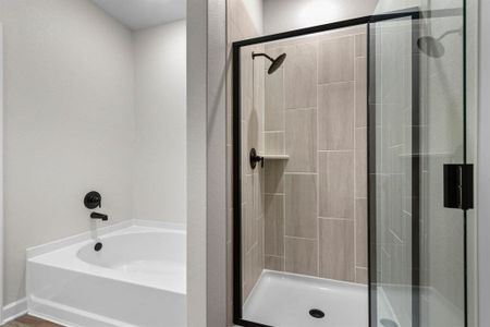 Adjacent primary bathroom with a walk-in closet!