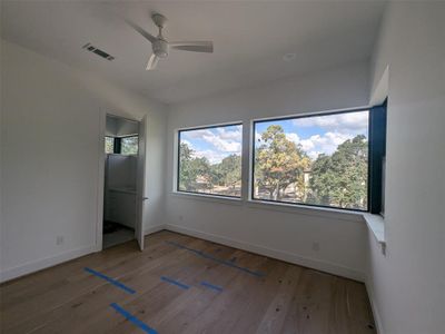 Front bedroom with large corner windows.