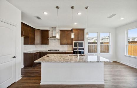 Spacious kitchen with oversized island*real home pictured