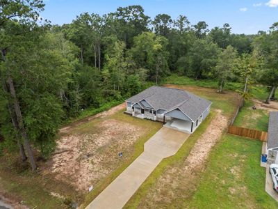 New construction Single-Family house 318 County Road 2221, Cleveland, TX 77327 - photo 4 4