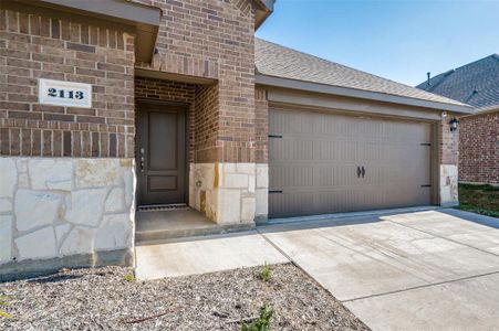 Entrance to property featuring a garage