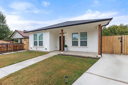 Ranch-style house with a patio and a front lawn