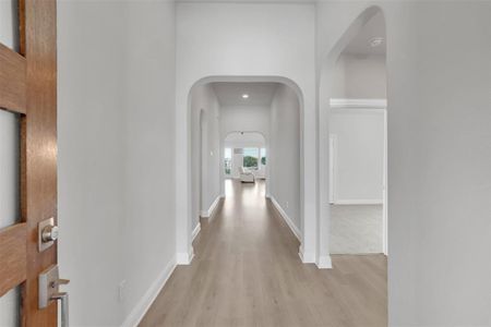 Hallway featuring light hardwood / wood-style flooring