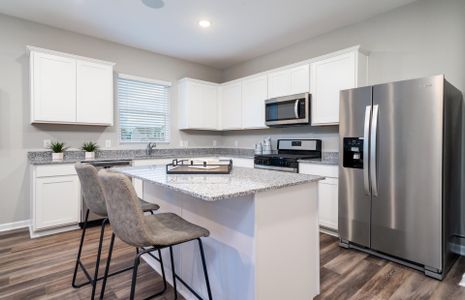 Spacious Kitchen with classic white cabinets.