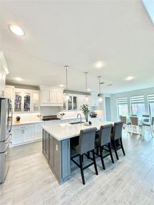 Kitchen has an island and breakfast nook.  Plenty of space for cooking and company.