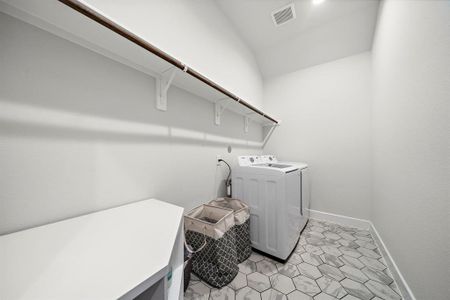 A generously sized utility room enhanced with modern features
