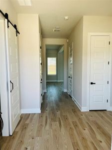 Front entrance with closet. Office/Flex room included at front of house with sliding barn door.