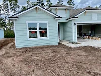New construction Single-Family house 12 Lumber Jack Trail, Palm Coast, FL 32137 - photo 1 1