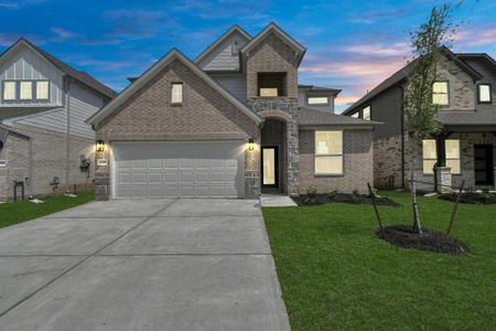 Sample photo of completed home with similar plan. As built color and selections may vary.