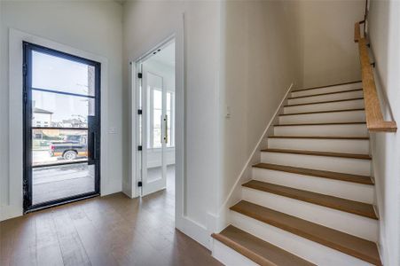 Entryway featuring a wealth of natural light and hardwood / wood-style flooring