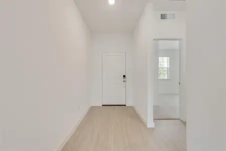 Hallway featuring light hardwood / wood-style floors