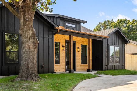 View of front of property with a front lawn