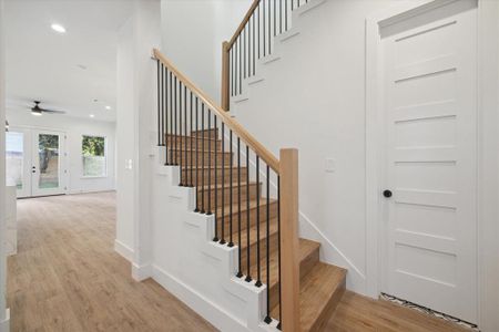 The entryway has the staircase to the second floor.  Luxury LVP white oak floors are found throughout the entire house.