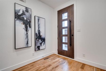 Entrance foyer with light wood-type flooring