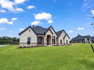 French country style house with a front yard