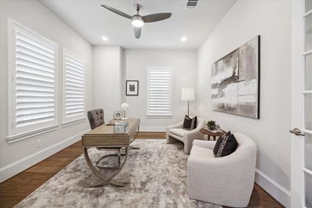 Elevate your work-from-home experience in this thoughtfully designed study, complete with tranquil views of the surrounding greenery, offering a sanctuary where you can unleash your creativity and productivity. Plantation shutters were newly installed.