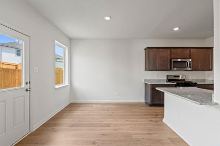 Dining area with light wood-type flooring