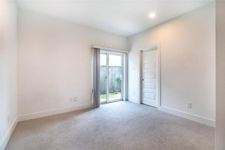 First-floor bedroom with an en-suite bath and access to the backyard