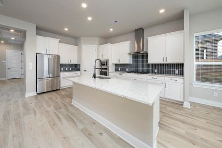 The chef ready kitchen includes a large pantry, stainless steel appliances and endless granite countertops.