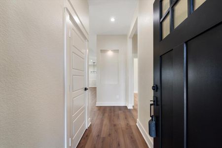 Upon entry, you are welcomed by luxury vinyl tile flooring and soaring 10-foot ceilings.