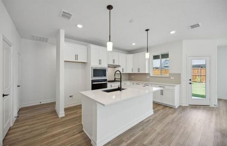 Bright kitchen with ample cabinet space *real home pictured