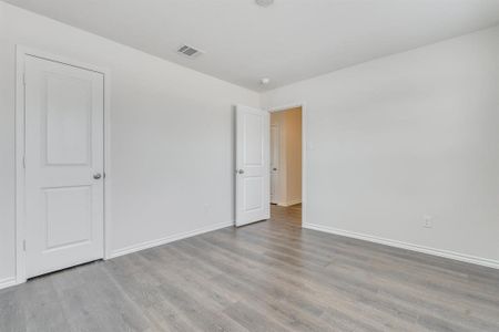 Spare room with light hardwood / wood-style floors