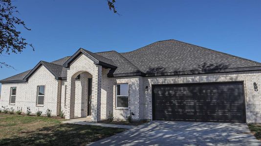 French country home featuring a garage