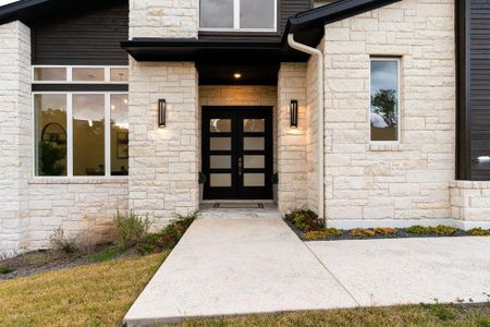 upon entering you are greeted by oversized custom metal doors