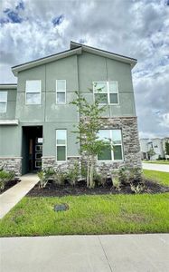 New construction Townhouse house 1700 Tropical Palms Circle, Kissimmee, FL 34747 - photo 0