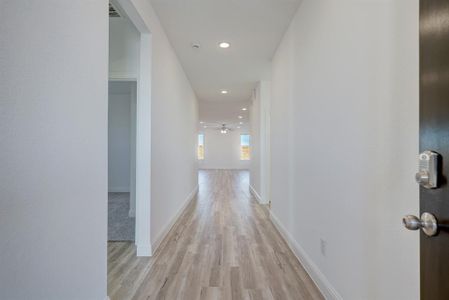 Long entry greets you with luxury vinyl plank flooring