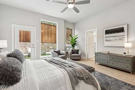 Bedroom featuring ceiling fan and light wood-type flooring