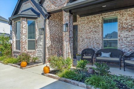 Property entrance with a patio