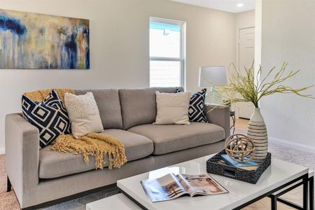 The spacious living room is open to the dining area and the kitchen.