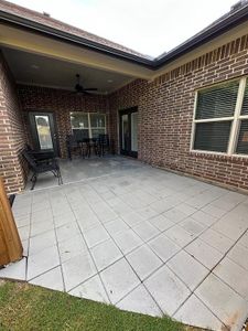 View of patio featuring ceiling fan