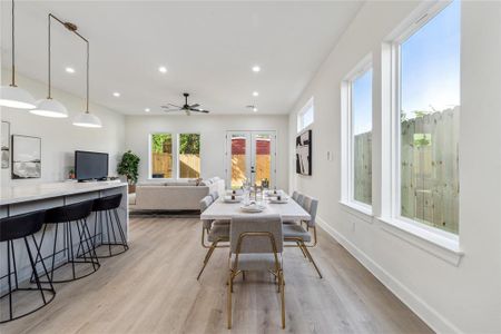 Experience seamless living in this thoughtfully designed home, where the kitchen and dining area effortlessly flow into the inviting living room, creating an open and cohesive space ideal for entertaining and family gatherings.