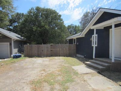 View of yard featuring a garage