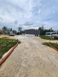 New construction Single-Family house 209 County Road 5805, Cleveland, TX 77327 - photo 1 1