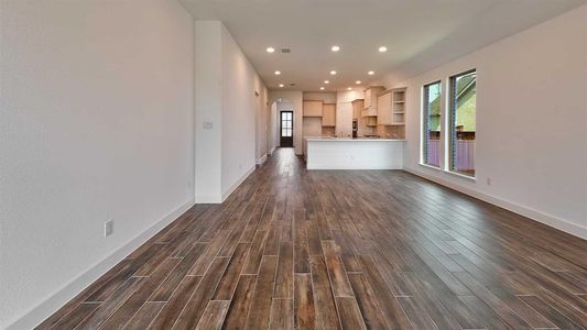 Unfurnished living room with dark hardwood / wood-style flooring