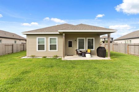 Enjoy the lush, professionally laid sod that enhances the outdoor appeal of this well-maintained backyard.