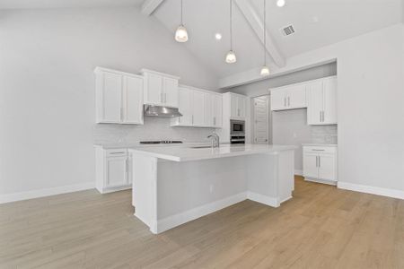 Eat in kitchen with white quartz counter top