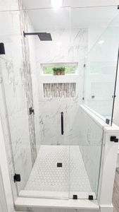 Bathroom featuring walk in shower