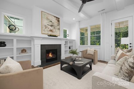 Family Room w/custom built-ins, gas fireplace & fixed transon windows