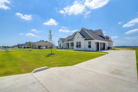 View of front facade with a front lawn and cooling unit