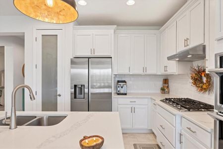 Kitchen has quartz countertops