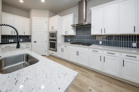This kitchen is sure to be the heart of your home.  Upper and lower case cabinets make a storage an ease.  The beautiful countertops provide lots of space for serving.