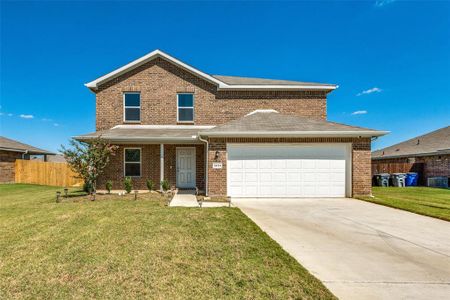 View of property with a front yard and a garage