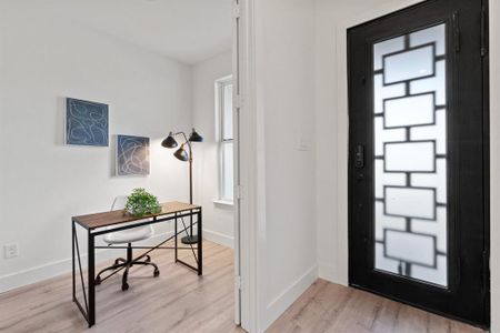 Foyer entrance featuring light hardwood / wood-style floors